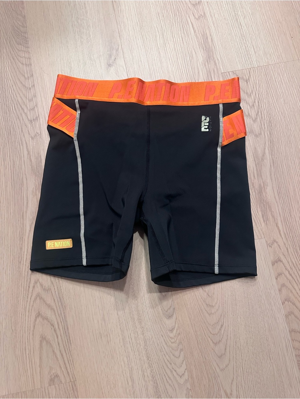 P.E NATION Black Bike Shorts with Orange Waistband